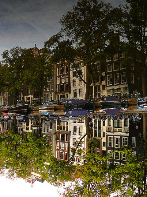 Buildings reflected in the Singel canal, Amsterdam, Netherlands